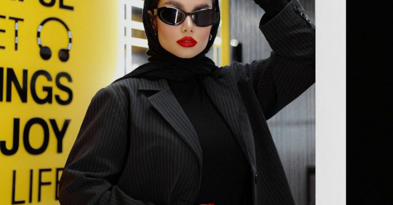 Contemporary Style - A woman in black sunglasses and a black jacket