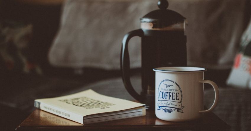 French Press Coffee - Closed Book Beside French Press and Mug