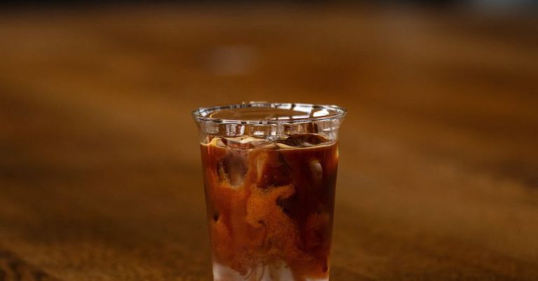 Bulletproof Coffee - A shot of iced coffee on a wooden table