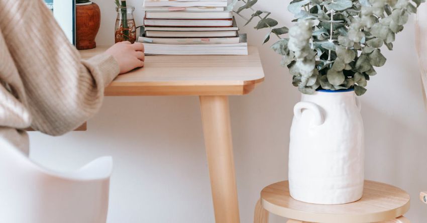 Styled Table - Anonymous woman working on laptop in room