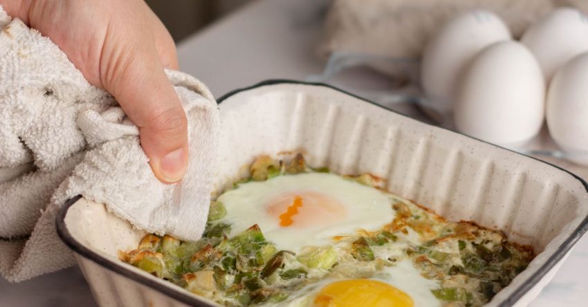 Repurpose Table - A person is putting eggs in a dish