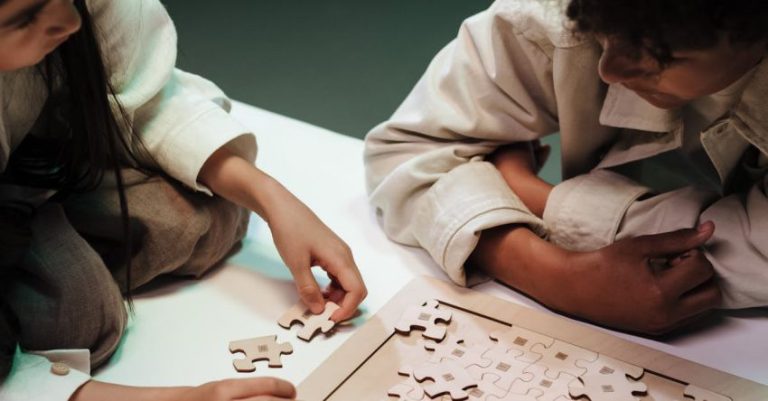 Adjustable Table - Children adjusting elements of jigsaw puzzles